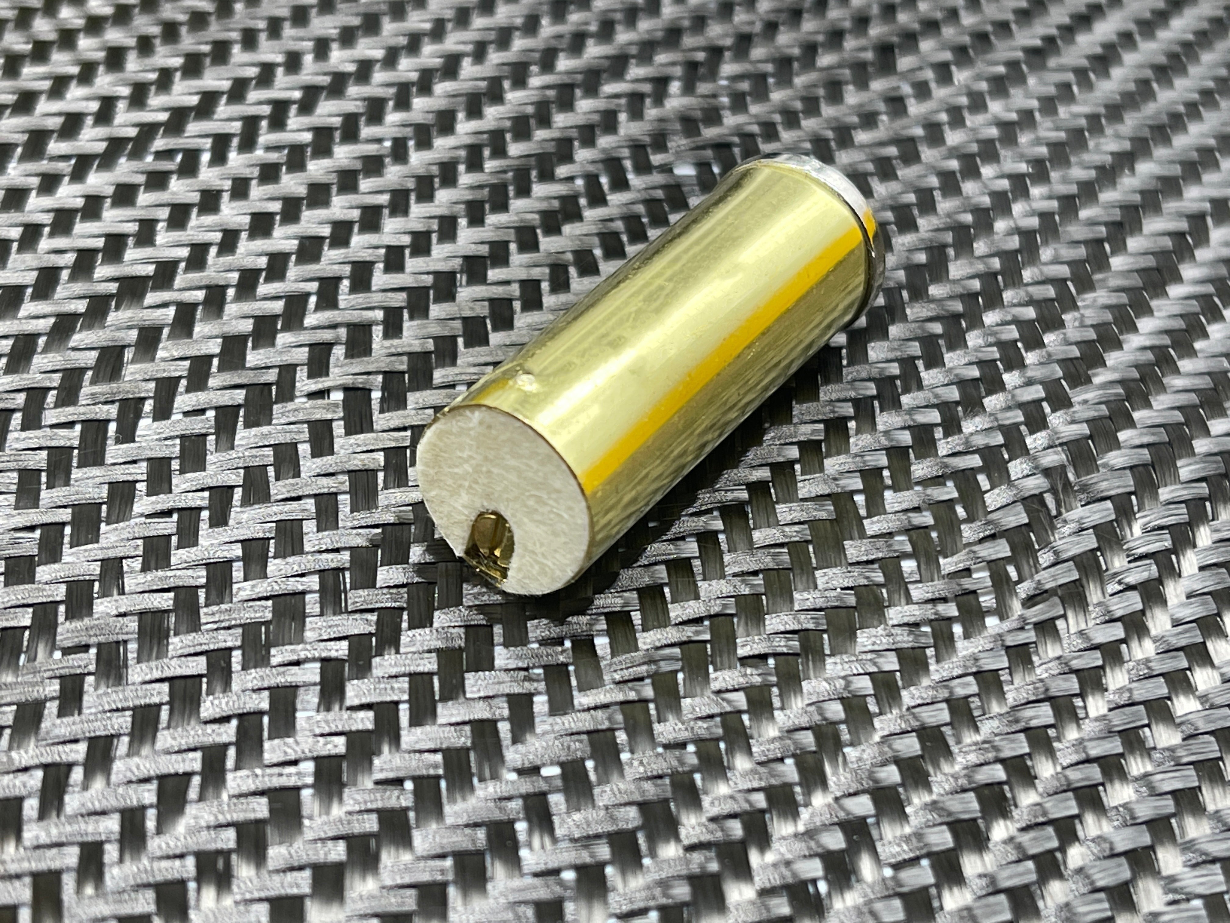 CountyComm Brass XL Peanut Lighter Gen 4 TOPO with full topo engraved body and flat end for emergency candle use.