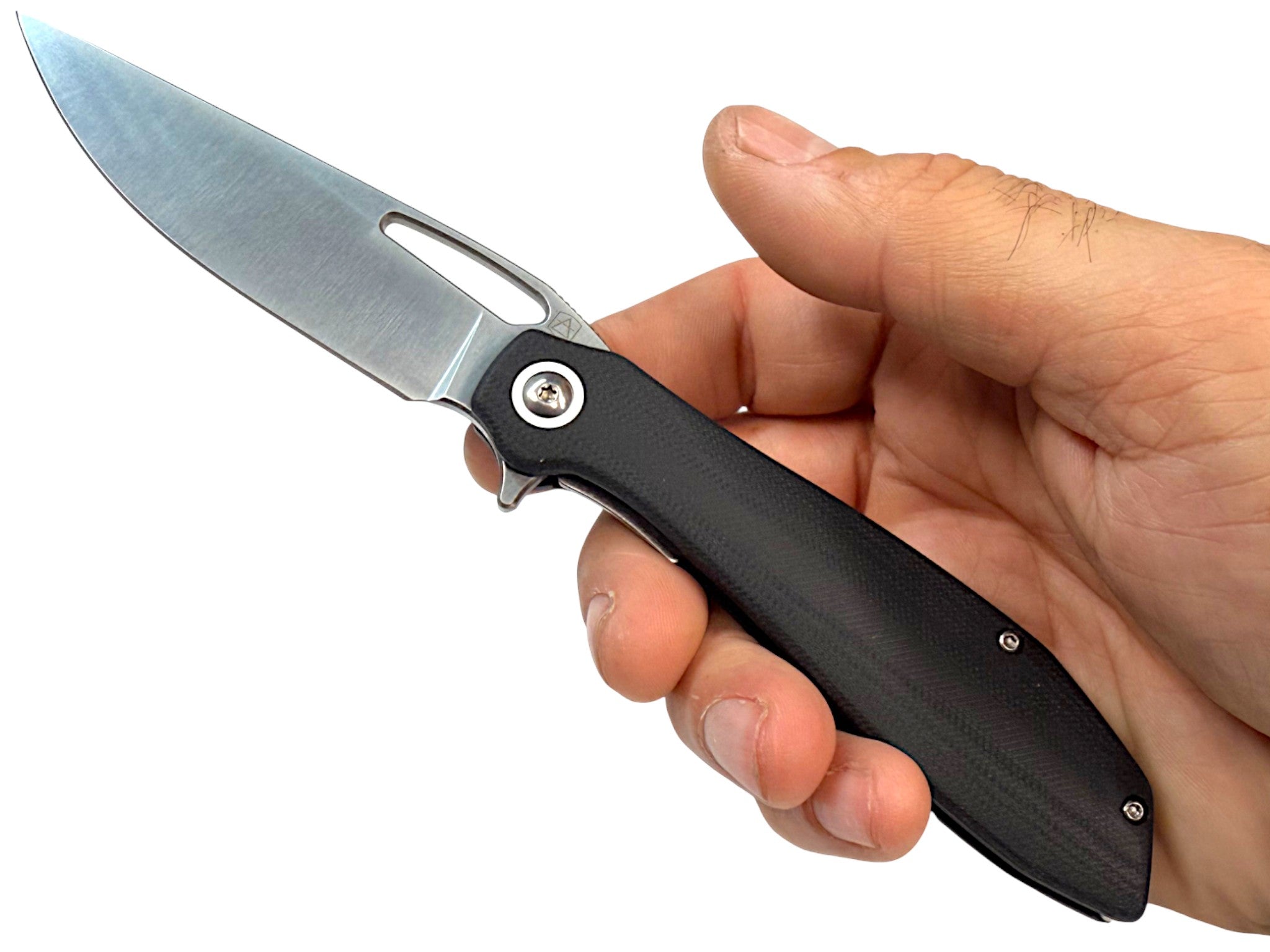 CountyComm Exclusive BXTR folding knife with a semi-polished 8Cr13MoV steel blade and black G10 handle, held in a hand.