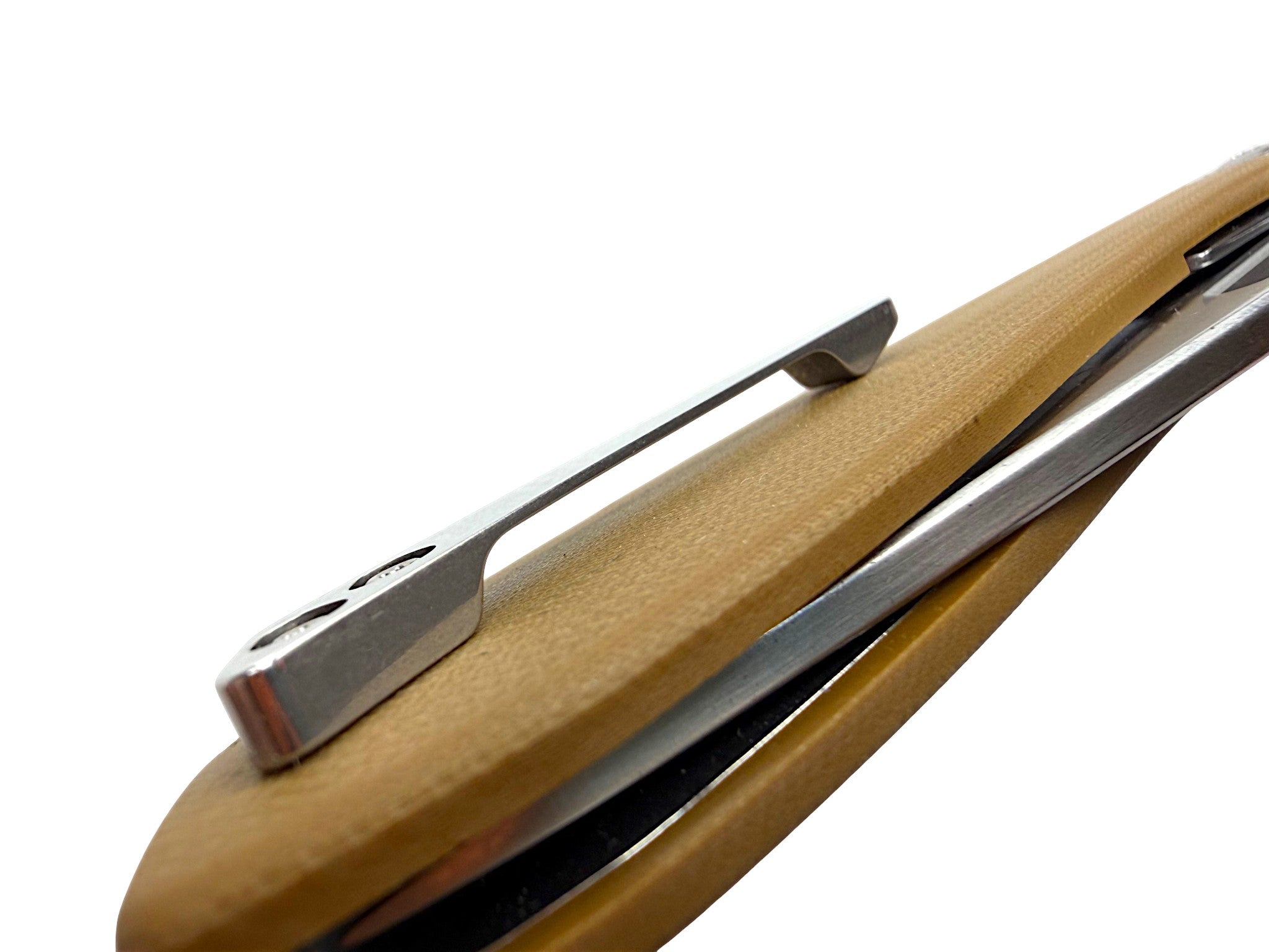 CountyComm BXTR folding knife with tan G10 handle and silver pocket clip. Semi-polished steel blade.
