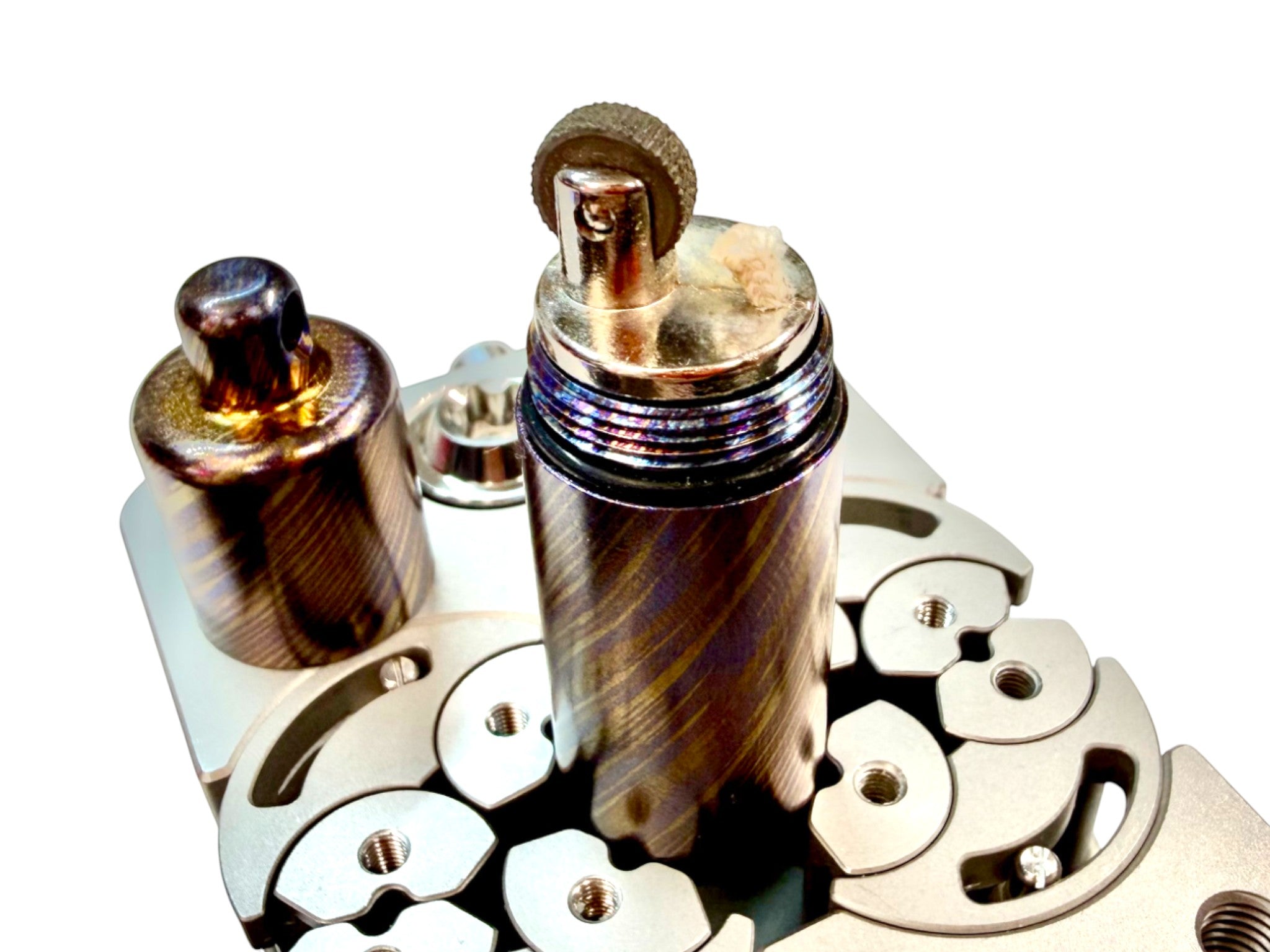 CountyComm Timascus Titanium XL Lighter V2 with unique swirling patterns and a brass insert. Includes a split ring.