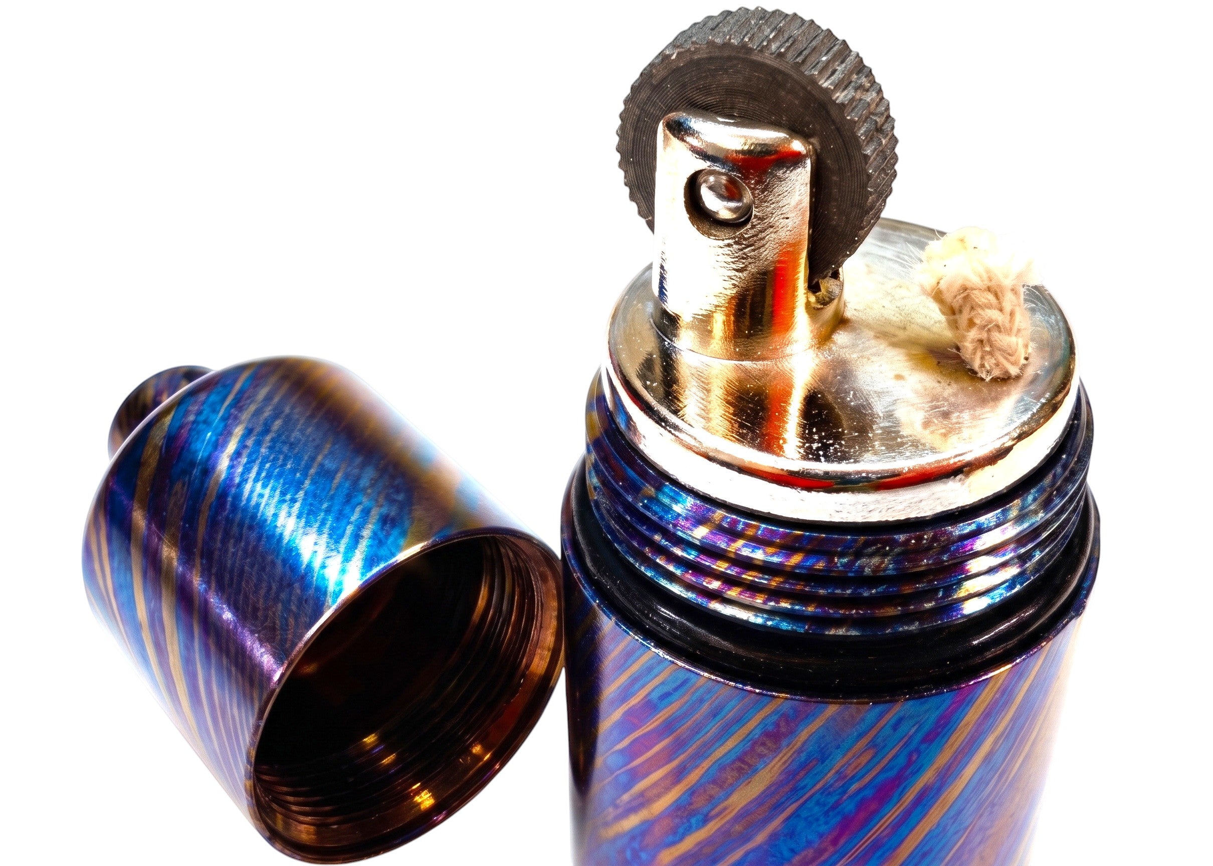 CountyComm Timascus Titanium XL Lighter with blue and purple swirling pattern, featuring a brass insert and flint wheel.